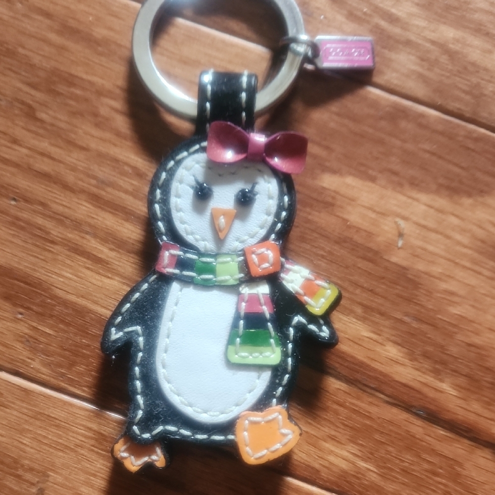 Discontinued Coach Penguin Keychain Toy with Pink Bow and Colorful Scarf
